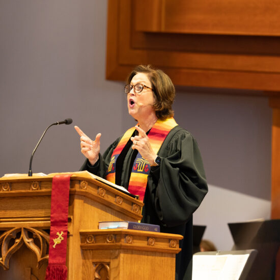 W Ser Intro Laura spking at Pulpit resized